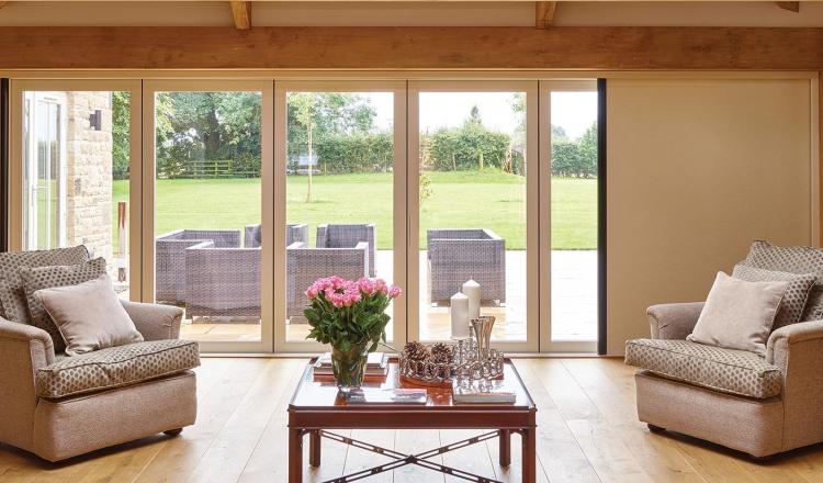 Centor aluminium bifold door featuring a built-in insect screen and shade