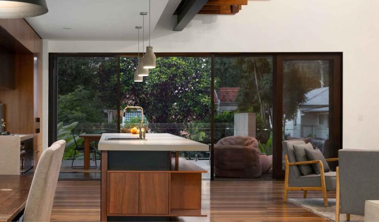 An open plan kitchen protected from insects by retractable screen