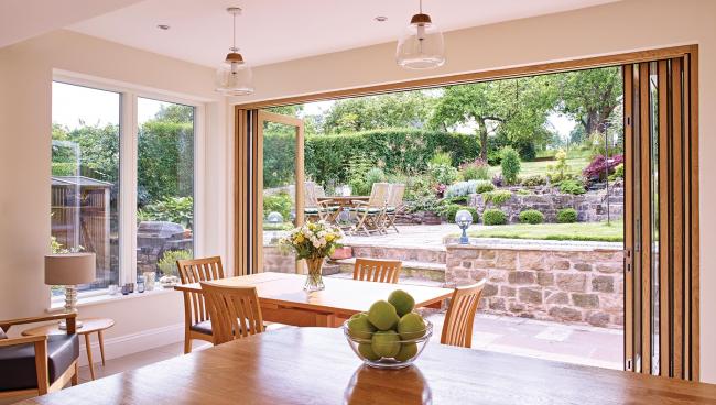A couple’s existing extension is completely transformed to invite in picturesque views of their garden.