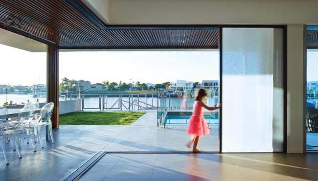 Centor exterior bifold door with integral blind for control of glare in the home
