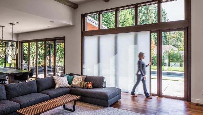 Two joining 205 Integrated Folding Doors with built-in light-filtering shade