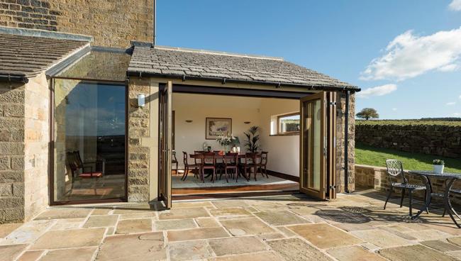 A light filled extension for a stone-built home now maximises spectacular views.