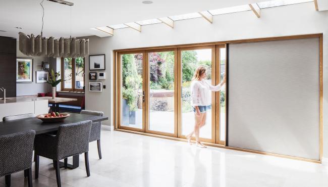 Two joining 205 Integrated Folding Doors with built-in blackout shade