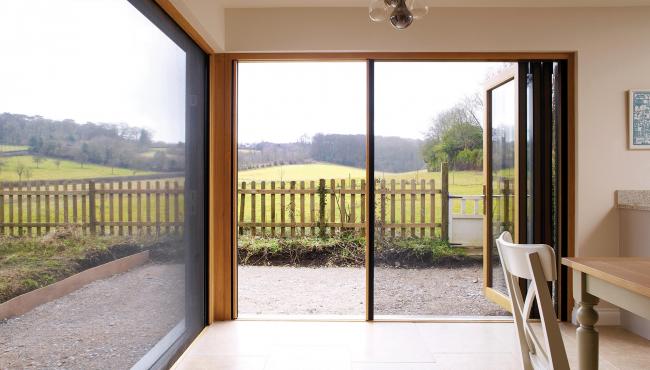 Two joining 205 Integrated Folding Doors with insect screen